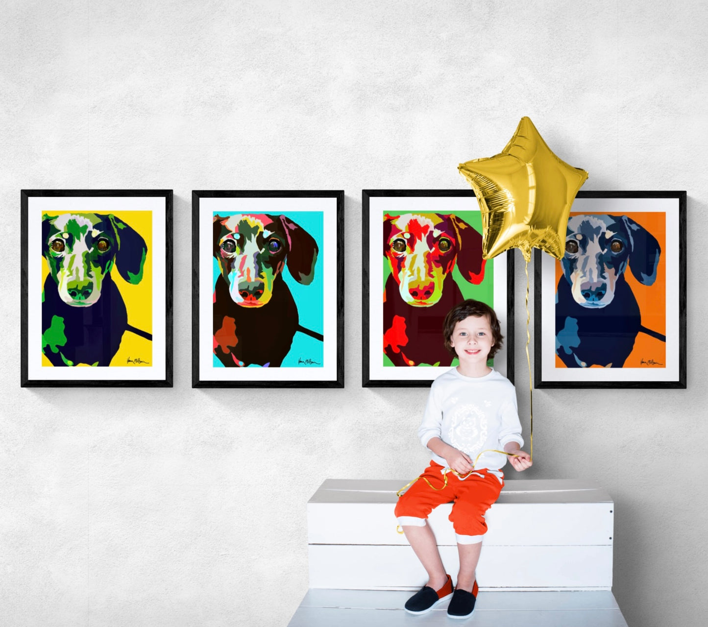 Four intricately designed original Pop-Art prints framwd in black, featuring a lovable dachshund in blue, yellow, orange and green colour backgrounds, lounging contently on a modern wall. 